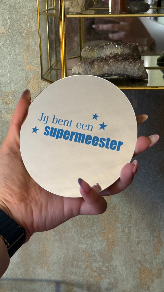 Rond spiegeltje met blauwe tekst “Jij bent een super meester” – cadeau voor meester einde schooljaar