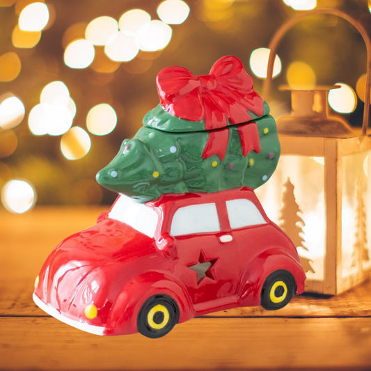 Rode auto waxmeltsbrander met kerstboom op dak – Rava Home
